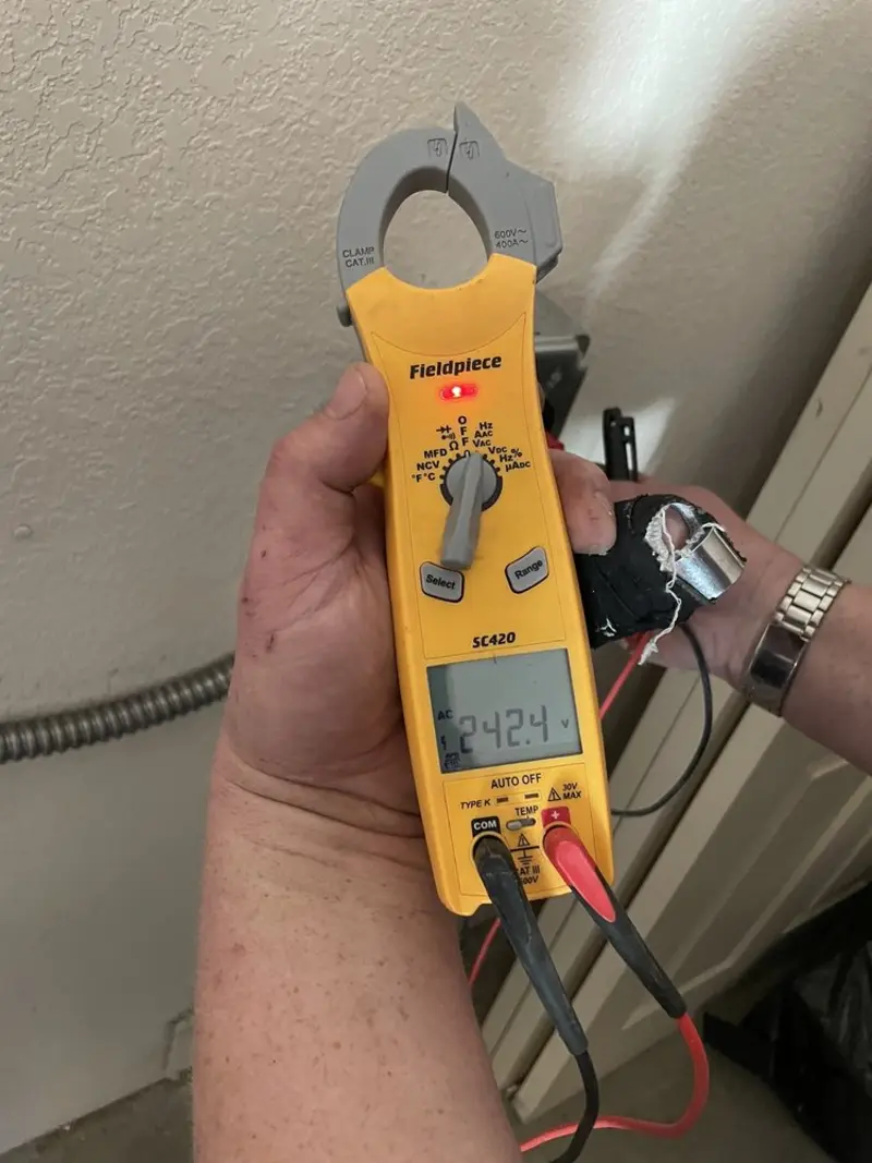 Voltage testing with clamp meter during Generator Installation in Lake Worth Beach